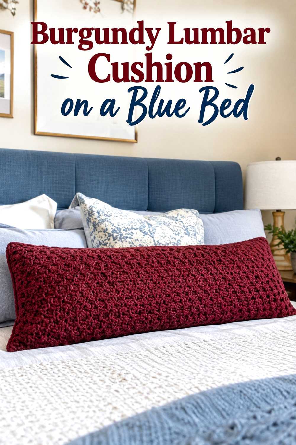 Burgundy lumbar cushion on a blue bed